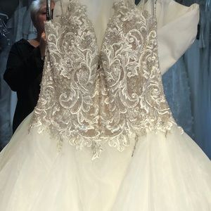 Mon Cheri Bridal ivory gown with beautiful silver and white lace.